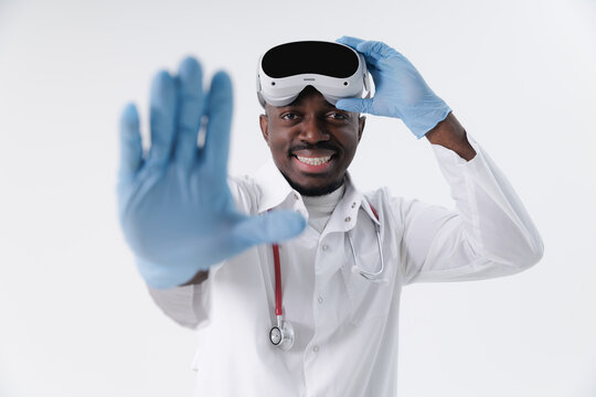 African male doctor with vr headset and stethoscope, wearing gloves and smiling, medical technology AI
