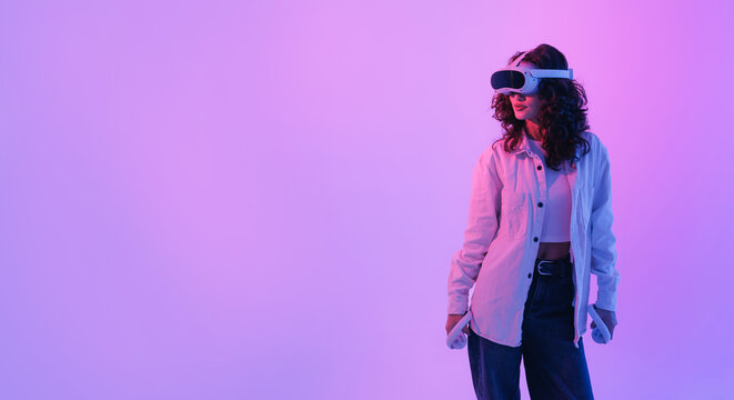Portrait Fashion Young asian female enjoying virtual reality experience in stylish outfit