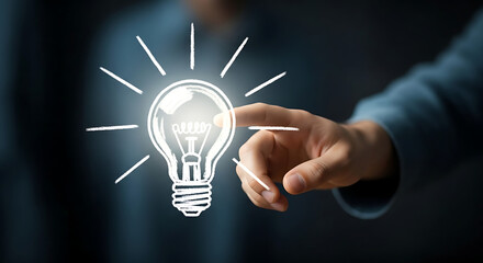 A person's hand touching a glowing lightbulb, symbolizing an idea or innovation.