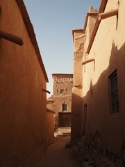 A walk through the narrow streets of the Arab ksar of Ait Ben Haddou, surrounded by traditional clay houses. Moroccan architecture, Travel to Morocco.