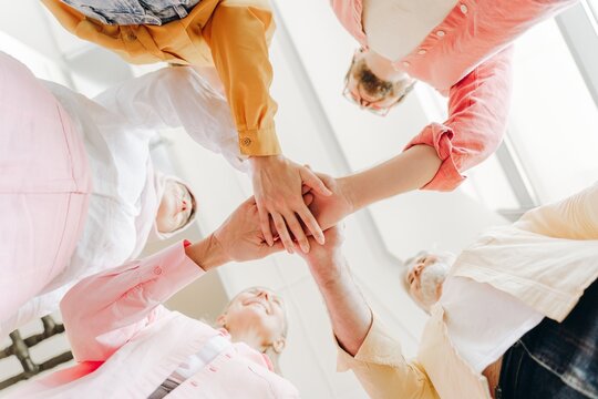 Diverse group of happy smiling businesswomen and businessmen together working in modern office - Powered by Adobe