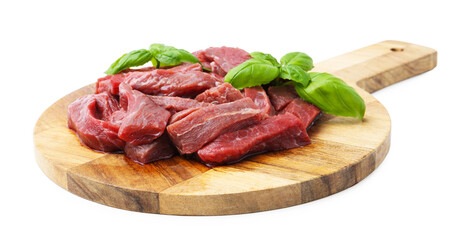 Pieces of raw beef meat and basil isolated on white