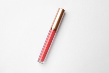 Beautiful pink lip gloss on white background, top view