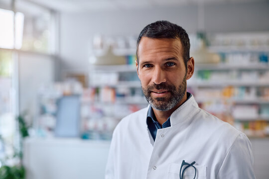 Portrait of smiling pharmacist looking at camera. - Powered by Adobe