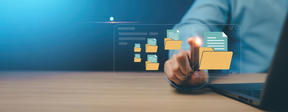 Digital File Management: A person navigates virtual file directories on a digital interface, illustrating the ease and efficiency of modern data management and digital files