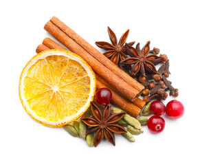 Different spices, cranberries and dry orange slice for mulled wine isolated on white, top view