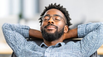 Relaxed Man Leaning Back with Closed Eyes in Peaceful Moment