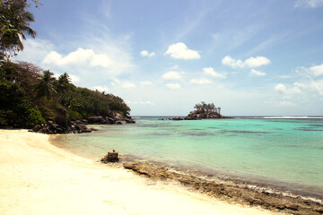 Tropical cove with small island on Mahé, Seychelles – tropical_sunny_beach_mahe_seychelles_B.jpg