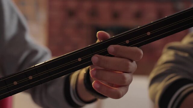 Hands Playing the Baglama (Saz), Traditional Turkish String Instrument