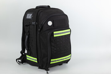 Black extra large tactical sanitary rescue backpack, studio shot on white background , side view.