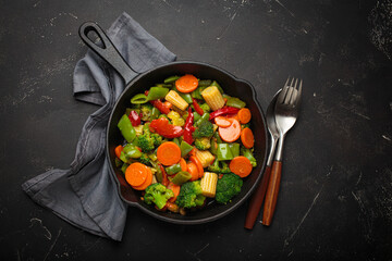 Stir fried colorful mixed vegetables cast iron skillet healthy cooking diet vegan