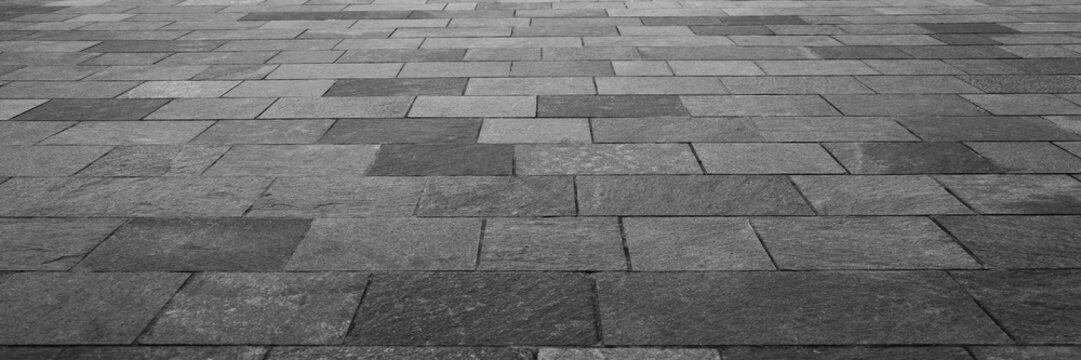 empty stone floor top in perspective. grey tile floor background in perspective view. line. empty copy space stone street. pavement. Granite outdoor tiled floor. gray granite. Marble texture