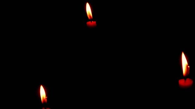 A candle burning in the dark, without electricity, darkness, ritual. Night space glowing softly with flickering light. Calm reflective mood.
