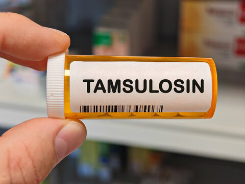 Box of TAMSULOSIN tablets on a hospital pharmacy table used to treat enlarged prostate an alpha blocker.