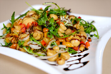 Warm mushroom salad with feta cheese and arugula on a linen napkin. High quality photo
