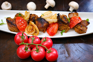 grilled meat with rosemary on wooden board. High quality photo