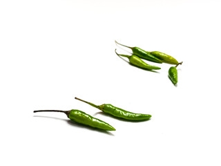 green chili peppers. green hot chili peppers with slices isolated on white background top view. Fresh green Chillies AS ingredients of cooking delicious hot food.