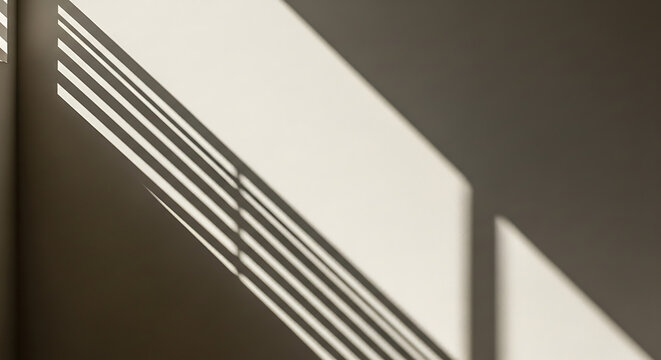 Abstract Sunlight and Shadow Play Geometric Light Patterns on a Wall