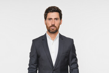 Close up portrait, serious and business man in studio isolated on a white background mockup space. Professional, entrepreneur and confident worker, employee and Caucasian consultant in suit.