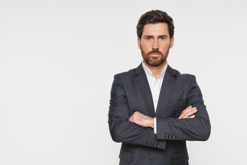 Confident business man company owner entrepreneur serious professional executive manager businessman leader looking at camera standing arms crossed isolated white studio background portrait copy space