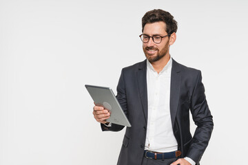 Businessman, confident and tablet for internet in studio on white background for startup company as salesman. Corporate, entrepreneur and browse online or website to network, search for opportunity