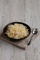 Organic White German Sauerkraut in a Bowl, side view.