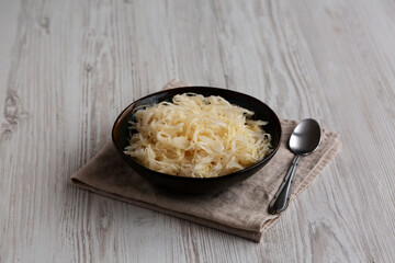 Organic White German Sauerkraut in a Bowl, side view.