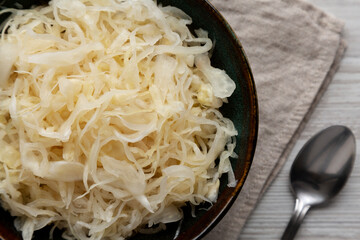 Organic White German Sauerkraut in a Bowl, top view. Close-up.