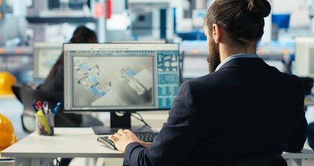 Photovoltaics factory worker drinks coffee, monitoring performance of robot arms placing solar...