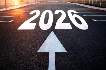 whiite arrow and 2026 written on concrete