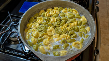 Tortellini Boiling on the Stovetop in a Home Kitchen 
