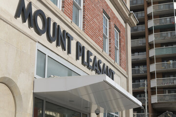 Fototapeta premium exterior building facade and sign of Mount Pleasant LRT Station, Eglinton Crosstown, located at 282 Eglinton Av E, Toronto