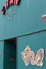 Fototapeta premium exterior building facade and sign of House of Chan, a restaurant, located at 514 Eglinton Av W, Toronto