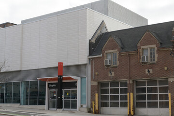 Fototapeta premium exterior of old building (fire hall) and Chaplin LRT Station located at 574 Eglinton Av W, Toronto