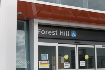 Fototapeta premium exterior entrance facade and sign at Forest Hill LRT Station, Eglinton Crosstown, located at 842 Eglinton Av W, Toronto
