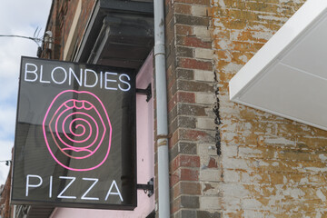 Fototapeta premium projecting sign outside Blondies Pizza Eglinton, a pizza restaurant, located at 280 Eglinton Av W, Toronto