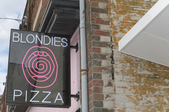 projecting sign outside Blondies Pizza Eglinton, a pizza restaurant, located at 280 Eglinton Av W, Toronto