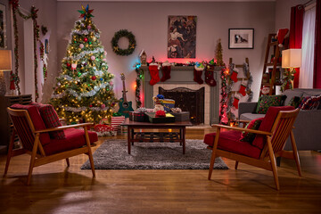 Cozy living room decorated for christmas with a beautifully lit tree and festive stockings