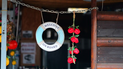 Welcome aboard sign hangs from a rope. Nautical decor. Beach theme. Coastal style. Vacation vibes....