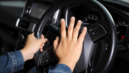 The driver is honking the horn to prevent an accident