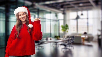 Beautiful santa girl in christmas hat on background