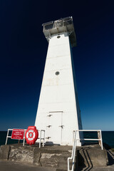The white and red trimmed Sodus Point Lighthouse at Sodus Bay on Lake Ontario in New York State