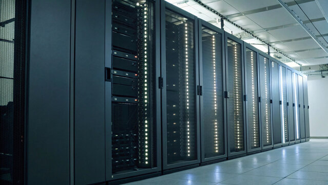 Business interior of a modern server room architecture with empty racks and glass walls, featuring bright floor lighting in a data center space