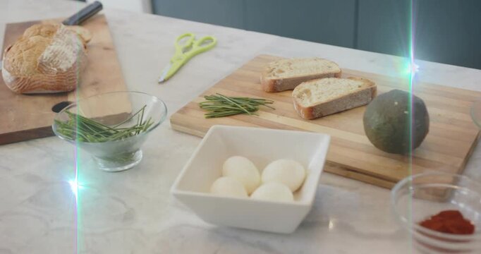 White square bowl holding four boiled eggs staying central while camera drifting, highlighting prep