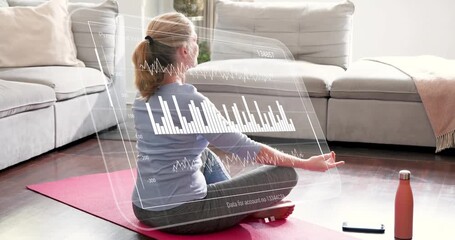 Mature adult woman pressing palms, extending arms as HUD appears, charts updating for wellness