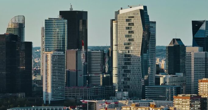 Commercial and business center of Paris, France. Aerial view of modern business district. Skyscrapers in futuristic La Defense district. Business district with iconic skyscrapers