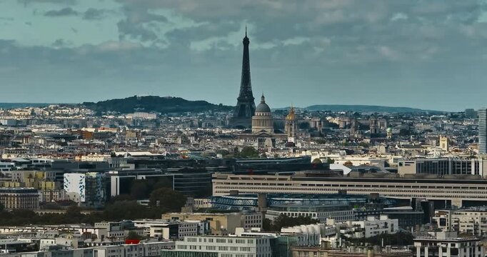 Aerial panning view of the historic center of Paris with the Eiffel Tower at summer day. Panorama of Paris from above. Aerial View on Eiffel Tower and Champ de Mars