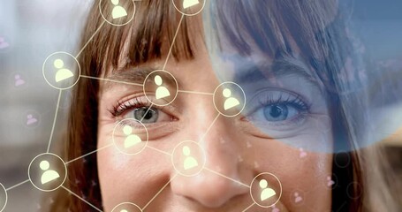 Woman holding gaze while brow marker appearing, network forming, showing social media icons - Powered by Adobe