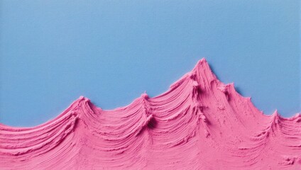 Abstract image of textured pink substance resembling a mountain range against a blue background