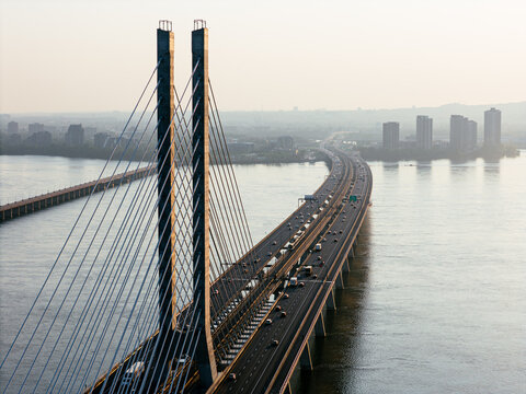 Cable stayed bridge over St Lawrence River at golden sunrise near Montreal and Brossard, Canada. g.